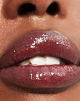 Close up of Roen Beauty Kiss My Lip Balm – Scout on lips of model with dark skin tone