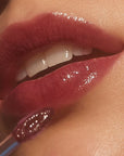Close up of model applying Roen Beauty Kiss My Lip Balm – Scout (3 ml)