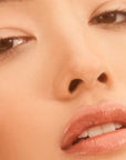 Roen Beauty Elixir Tinted Lip Oil Balm – Alba showing on model