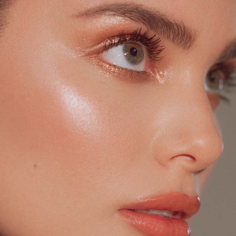 Roen Beauty Roglow Skin Stick Highlighter – Glazed showing on cheek