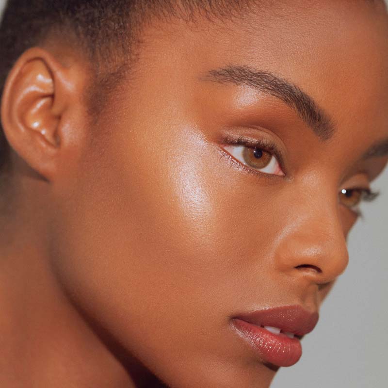 Roen Beauty Roglow Skin Stick Highlighter – Lit showing on model 