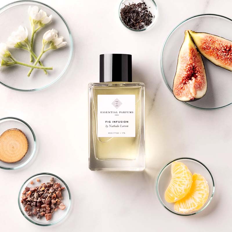 Essential Parfums Fig Infusion by Nathalie Lorson showing bottle with different plates with oranges, figs, wood and other different notes