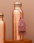 Tamra Copper LA Tamra Tassel: Mauve showing on brass bottle