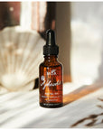 MOA Aphrodite Organic Facial Oil showing bottle with shell 