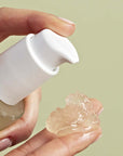 Rahua by Amazon Beauty Aloe Vera Hair Gel showing model putting smear of gel on fingers