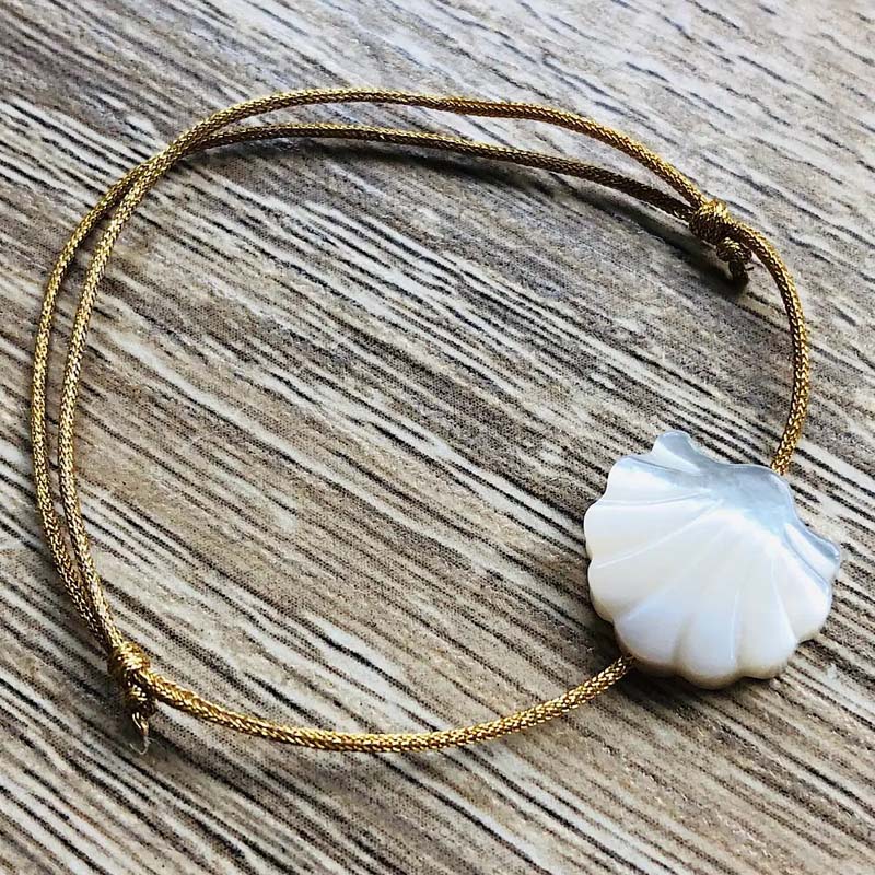 YSIE Golden Camille Bracelet – Shell - Product shown on table