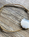 YSIE Golden Camille Bracelet – Shell - Product shown on table