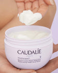 Caudalie Vinotherapist Replenishing Vegan Body Butter showing model scooping out product