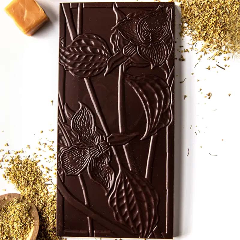 Wildwood Chocolate Fennel Pollen Caramel showing different ingredients next to chocolate bar