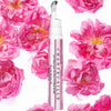 Chantecaille Rose De Mai Eye Lift showing with flowers surrounding eye lift