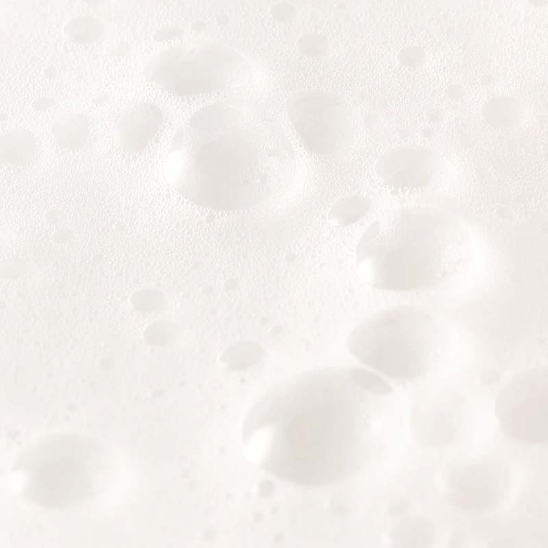 NEOM Organics Super Shower Power Shampoo showing smear