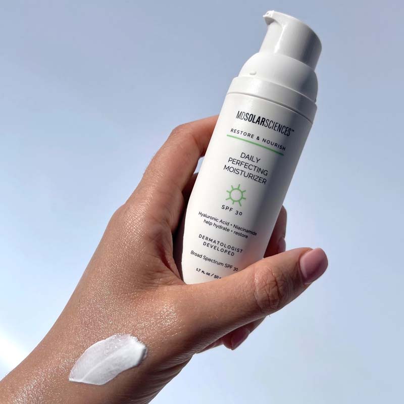 MDSolarSciences Daily Perfecting Moisturizer SPF 30 showing smear on hand and product in hand
