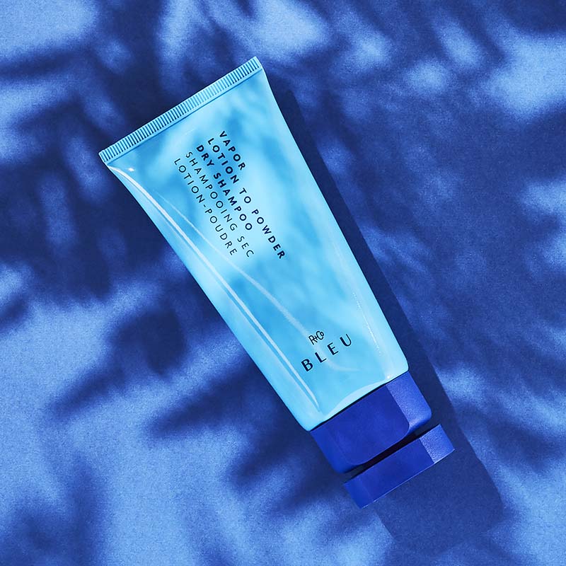 R+Co Bleu Vapor Lotion to Powder Dry Shampoo showing with blue print 