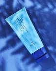 R+Co Bleu Vapor Lotion to Powder Dry Shampoo showing with blue print 