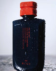 R+Co Bleu Primary Color Shampoo showing with water drops on product