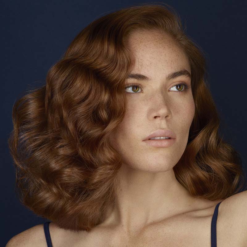 R+Co Bleu Ingenious Thickening Conditioner showing on models styled hair