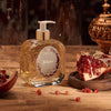Santa Maria Novella Melograno Liquid Soap sitting on counter surrounded by pomegranate seeds 