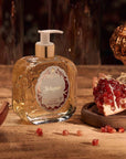 Santa Maria Novella Melograno Liquid Soap sitting on counter surrounded by pomegranate seeds 