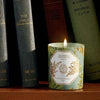 Carriere Freres Absinthe Candle showing on a book shelf surrounded by green books