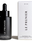 Le Prunier Plum Beauty Oil showing next to white packaging