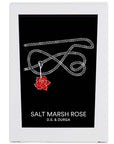 D.S. & Durga Salt Marsh Rose Candle showing white box with black label with a red rose hanging from a rope