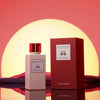 Eau d'Italie Mystic Sunset Eua de Parfum Spray showing bottle next to packaging in front of a sunset