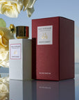 Eau d'Italie Mystic Sunset Eau de Parfum Spray (100 ml) with box and white roses and ocean in the background