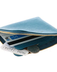 Delfonics Quitterie Half Zip Case – Turquoise showing inside of case with a card and change 
