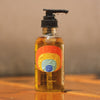 Bathing Culture Heat Wave Body Oil - Nude Beach (4 oz) shown on wood table