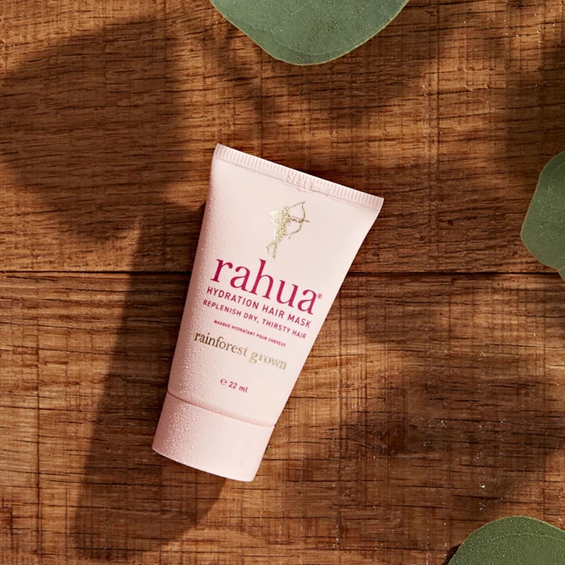 Rahua by Amazon Beauty Rahua Hydration Hair Mask showing on wood with green leaves around the edge