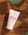 Rahua by Amazon Beauty Rahua Hydration Hair Mask showing on wood with green leaves around the edge