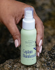 Lifestyle and close up shot of model holding NOURISH Hair & Scalp Serum with Camelia & Seaweed (59 ml)