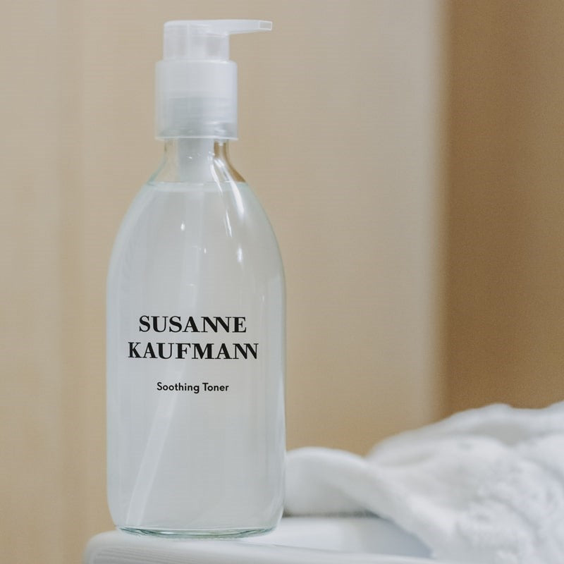 Susanne Kaufmann Soothing Toner beauty shot of bottle on a towel