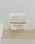 Susanne Kaufmann Enzyme Exfoliator - Product on shelf by towel.