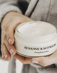 Susanne Kaufmann Body Butter showing jar in model's hands