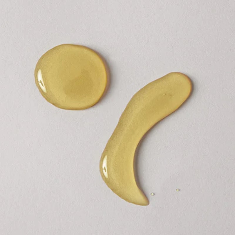 A.OK Body Oil showing product smear for texture