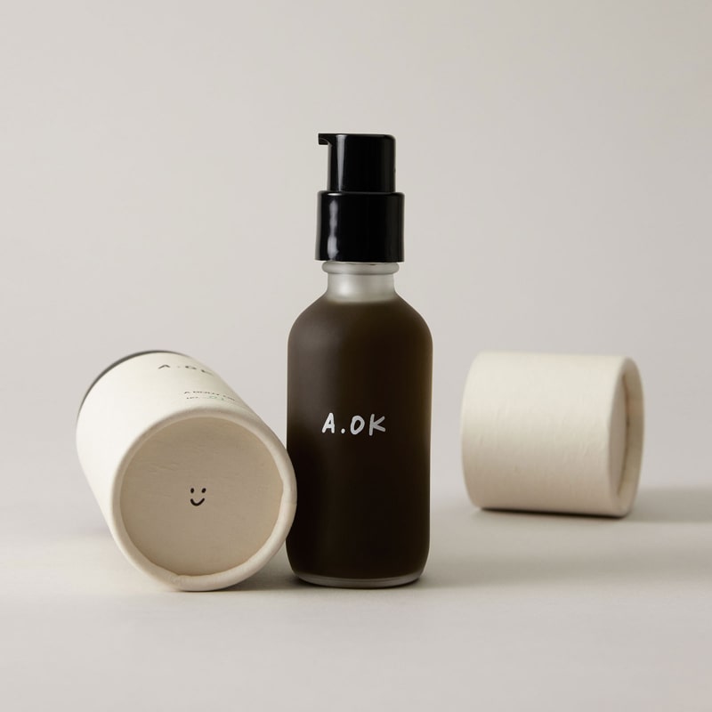 A.OK Body Oil showing lid off 