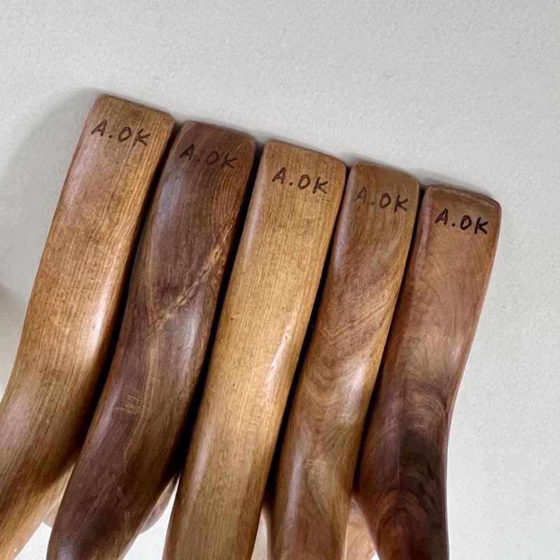 A.OK The Bird Massage Tool showing brand name on wood
