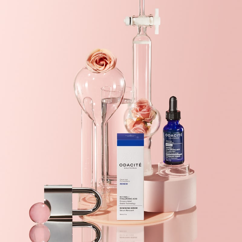 Odacite Retinol + Hyaluronic Acid Renewing Serum beauty shot with flowers and pink background