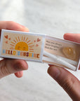 Marvling Bros Ltd Hello Sunshine Mindfulness Gift In A Matchbox showing open box in model's hands for size perspective