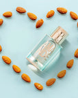 Solinotes Paris Amande (Almond) Eau de Parfum beauty shot of bottle surrounded by almonds arranged to form a heart outline (not included)