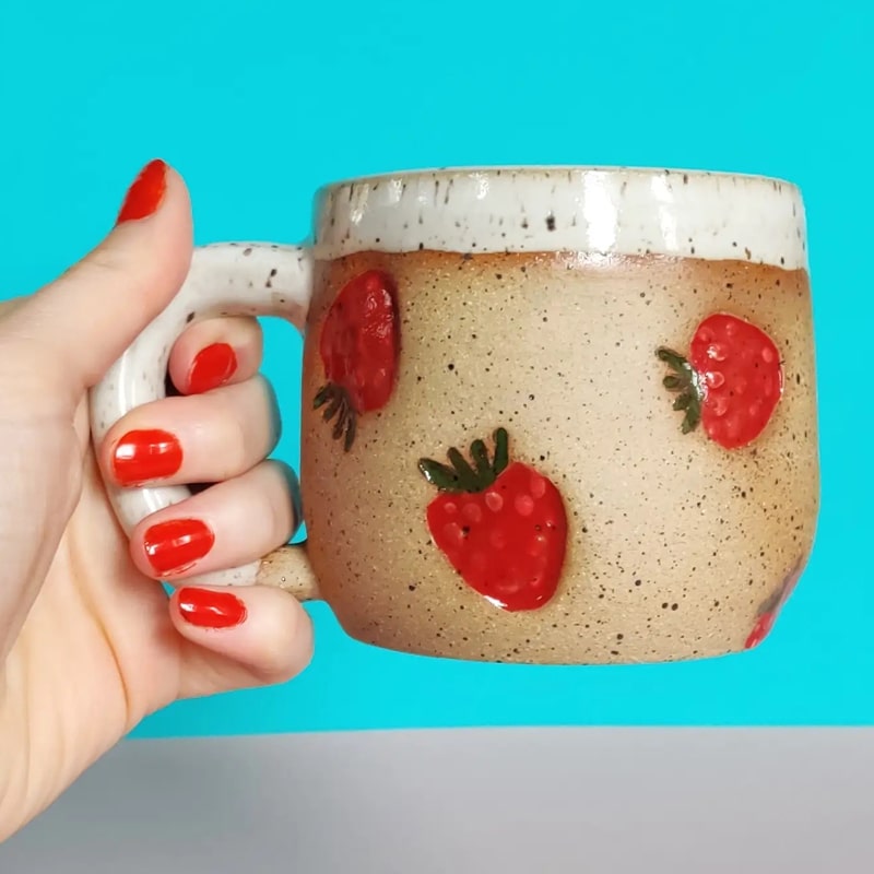 Osso Ceramics Strawberry Stamped Mug - Model holding mug