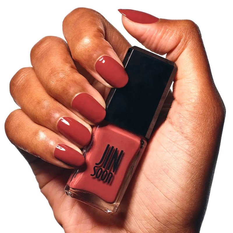 JINsoon Nail Lacquer – Fire Clay - Product shown in models hand