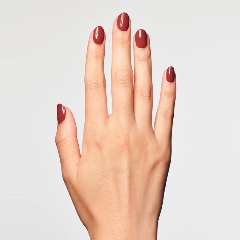 Model wearing JINsoon Nail Lacquer – Fire Clay