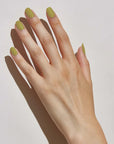 Model with light skin tone wearing JINsoon Nail Lacquer – Green Clay