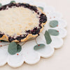 Caravan Home Marble Petal Tray - Medium - lifestyle shot  showing a pie and eucalyptus brandh  on the tray (not included)