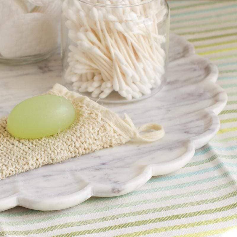 Caravan Home Marble Petal Tray - Large - lifestyle shot showing close-up detail of edge while platter has cotton swabs and soap and scrubber on it (not included)