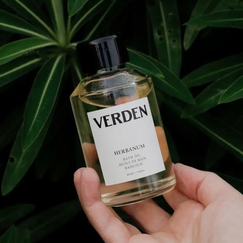 Verden Herbanum Bath Oil - Product shown in models hand 