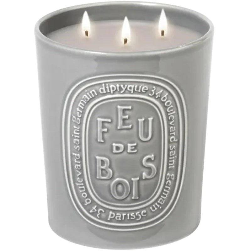 Diptyque Feu De Bois Candle - Product shown with wicks lit