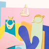 Octaevo Multi-Use Clips – Navigator showing clips on colored paper collage
